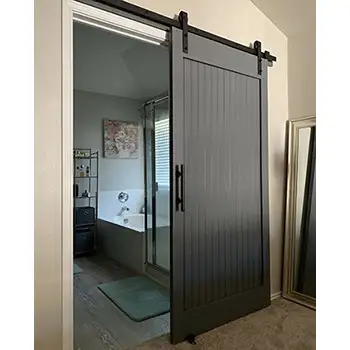 Black wooden interior sliding barn door for bathroom privacy