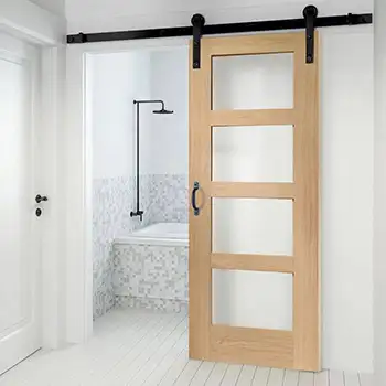 Wood shaker style four lite frosted glass barn door for bathroom